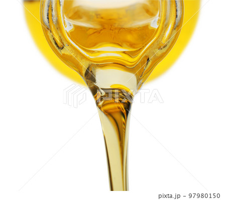 Pouring cooking oil from pitcher isolated on white 97980150