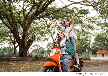 Two naughty high school girls ride on a reckless motorbike 97980743