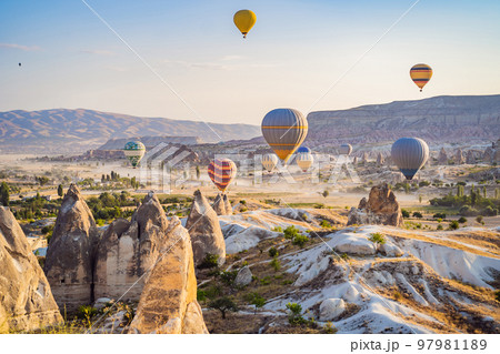 Colorful hot air balloon flying over Cappadocia, Turkey Colorful hot air balloon flying over Cappadocia, Turkey 97981189