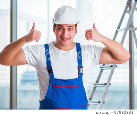 Young worker with safety helmet hardhat 97983333