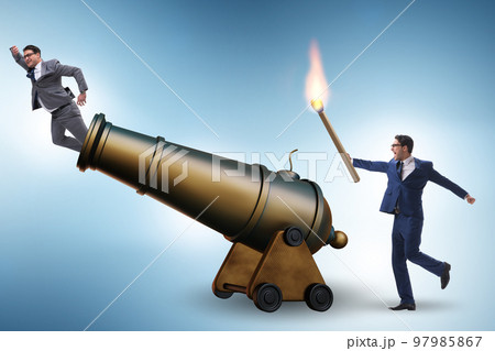 Concept of lay-off with businessman and cannon 97985867