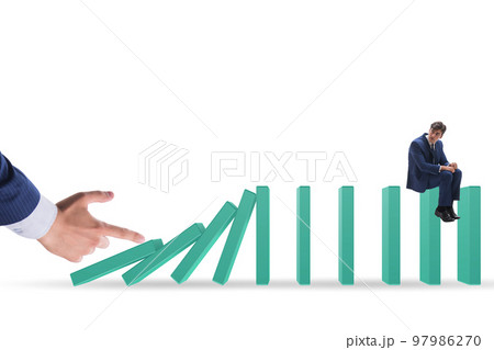 Businessman in domino effect concept Businessman in domino effect concept 97986270