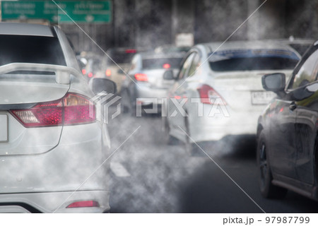 Smoke pollution from car exhaust pipes, traffic jams on the roads at rush hour. 97987799