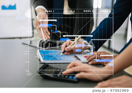Project manager working and update tasks with milestones progress planning and Gantt chart scheduling diagram.business tram working at office 97992969