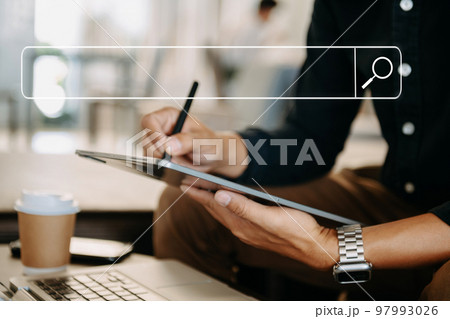 Searching Browsing Internet Data Information Networking Concept with blank search bar.man working with mobile phone and laptop computer VR icon in office. Searching Browsing Internet Data Information Networking Concept with blank search bar.man working with mobile phone and laptop computer VR icon in office. 97993026