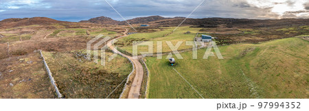 Aerial view of the track to Agnish Lough by Maghery, Dungloe - County Donegal - Ireland. 97994352
