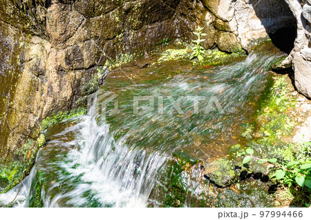 Photography on theme beautiful fall water from garden waterfall Photography on theme beautiful fall water from garden waterfall 97994466