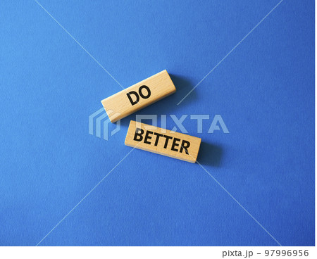 Do better symbol. Wooden blocks with words Do better. Beautiful blue background. Business and Do better concept. Copy space. 97996956