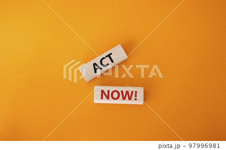 Act now symbol. Wooden blocks with words Act now. Beautiful orange background. Business and Act now concept. Copy space. 97996981