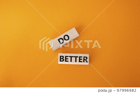 Do better symbol. Wooden blocks with words Do better. Beautiful orange background. Business and Do better concept. Copy space. Do better symbol. Wooden blocks with words Do better. Beautiful orange background. Business and Do better concept. Copy space. 97996982