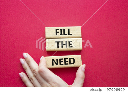 Fill the need symbol. Concept word Fill the need on wooden blocks. Beautiful red background. Businessman hand. Business and Fill the need concept. Copy space Fill the need symbol. Concept word Fill the need on wooden blocks. Beautiful red background. Businessman hand. Business and Fill the need concept. Copy space 97996999