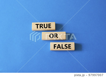 True or false symbol. Wooden blocks with words True or false. Beautiful white background. Businessman hand. Business concept and True or false. Copy space. 97997007