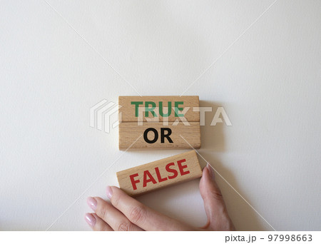 True or false symbol. Wooden blocks with words True or false. Beautiful white background. Businessman hand. Businessman hand. Business concept and True or false. Copy space. True or false symbol. Wooden blocks with words True or false. Beautiful white background. Businessman hand. Businessman hand. Business concept and True or false. Copy space. 97998663