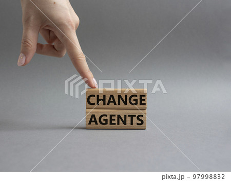 Change agents symbol. Concept word Change agents on wooden blocks. Beautiful grey background. Businessman hand. Business and Change agents concept. Copy space Change agents symbol. Concept word Change agents on wooden blocks. Beautiful grey background. Businessman hand. Business and Change agents concept. Copy space 97998832