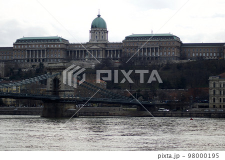 BUDAPEST, HUNGARY - 03 MAR 2019: The Royal Palace, site of the Hungarian National Gallery. Chain Bridge in the foreground 98000195