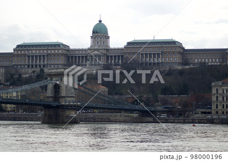 BUDAPEST, HUNGARY - 03 MAR 2019: The Royal Palace, site of the Hungarian National Gallery. Chain Bridge in the foreground 98000196