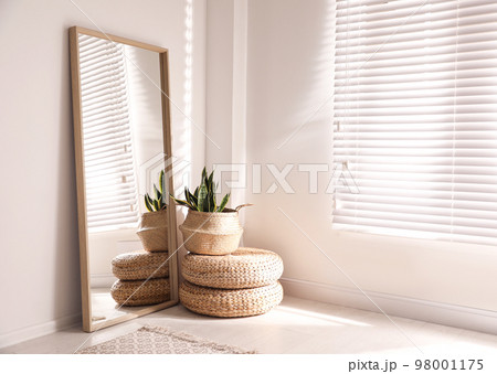 Large stylish mirror in room, space for text. Element of interior design 98001175