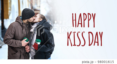 Happy kiss day web banner. Kiss day, February 13, golden day in Valentines week. Express love for beloved people. Young couple in love kissing in winter city street park. Happy kiss day web banner. Kiss day, February 13, golden day in Valentines week. Express love for beloved people. Young couple in love kissing in winter city street park. 98001615
