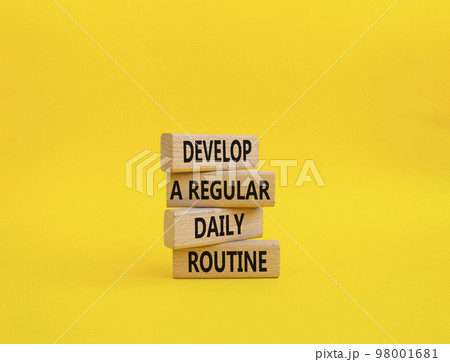 Develop a regular daily routine symbol. Concept words Develop a regular daily routine on wooden blocks. Beautiful yellow background. Business and Develop a regular daily routineconcept. Copy space. Develop a regular daily routine symbol. Concept words Develop a regular daily routine on wooden blocks. Beautiful yellow background. Business and Develop a regular daily routineconcept. Copy space. 98001681