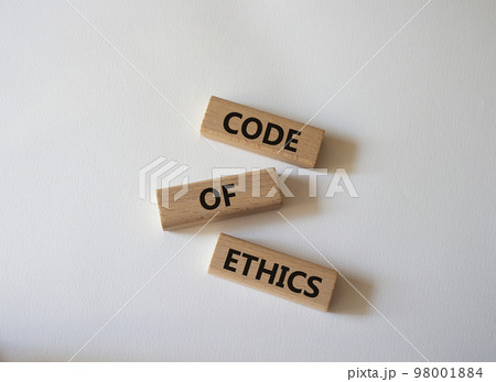 Code of ethics symbol. Concept words Code of ethics on wooden blocks. Beautiful white background. Business and Code of ethics concept. Copy space. Code of ethics symbol. Concept words Code of ethics on wooden blocks. Beautiful white background. Business and Code of ethics concept. Copy space. 98001884