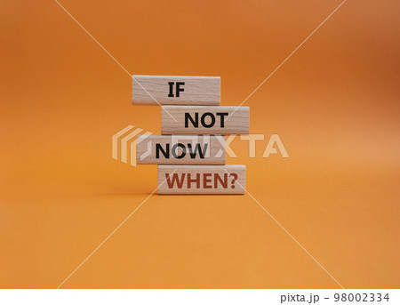 If not now when symbol. Concept words If not now when on wooden blocks. Beautiful orange background. Business and If not now when concept. Copy space. 98002334