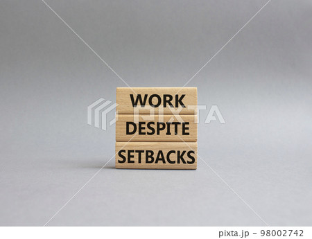 Work despite setbacks symbol. Wooden blocks with words Work despite setbacks. Beautiful grey background. Business and Work despite setbacks concept. Copy space. Work despite setbacks symbol. Wooden blocks with words Work despite setbacks. Beautiful grey background. Business and Work despite setbacks concept. Copy space. 98002742