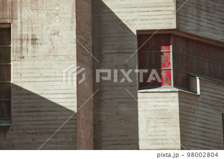 Stained glass window in concrete facade on a church that looks like a bunker in Cologne, Germany Stained glass window in concrete facade on a church that looks like a bunker in Cologne, Germany 98002804