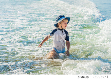 happy little boy running on sand tropical beach happy little boy running on sand tropical beach 98002971