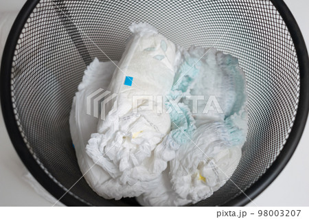 Used diapers in bin, top view. 98003207