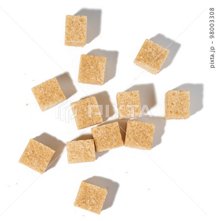 Cane sugar cubes on white background, top view Cane sugar cubes on white background, top view 98003308