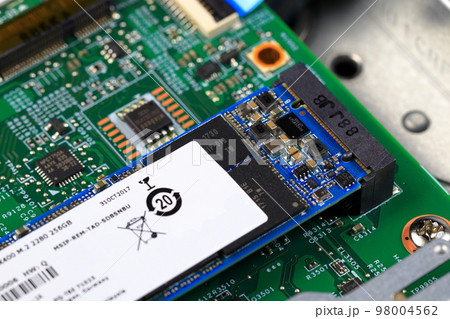 SSD PCle NVMe M.2 on green motherboard background SSD PCle NVMe M.2 on green motherboard background 98004562