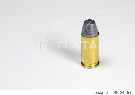 close up bullet 9mm LSWC ( Lead Semi wadcutter ) with brass shell ready for use, isolate on white background. close up bullet 9mm LSWC ( Lead Semi wadcutter ) with brass shell ready for use, isolate on white background. 98004563
