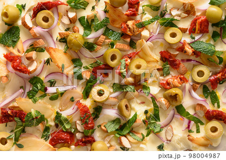 Butter board with onion, olives, herbs and bread. Butter board with onion, olives, herbs and bread. 98004987