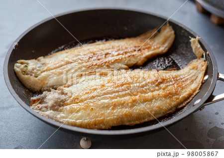 Sole fish prepared on a frying pan 98005867