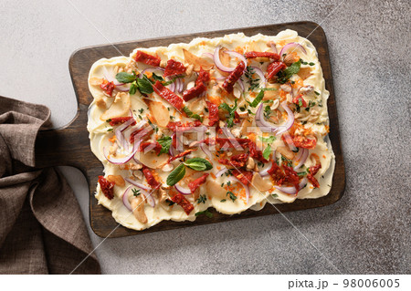 Butterboard with garlic, sun-dried tomatoes, herb. Butterboard with garlic, sun-dried tomatoes, herb. 98006005