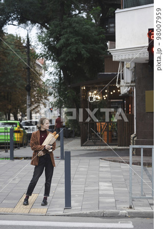 beautiful girl with baguettes and coffee beautiful girl with baguettes and coffee 98007959