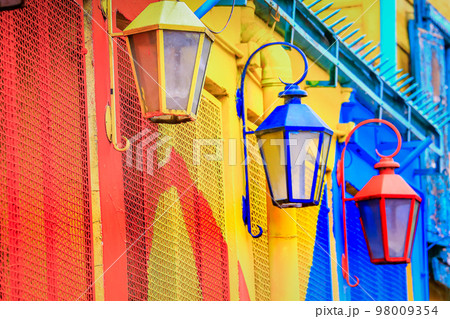 Colorful facade on Caminito Street with Street lamps, in Buenos Aires, Argentina Colorful facade on Caminito Street with Street lamps, in Buenos Aires, Argentina 98009354