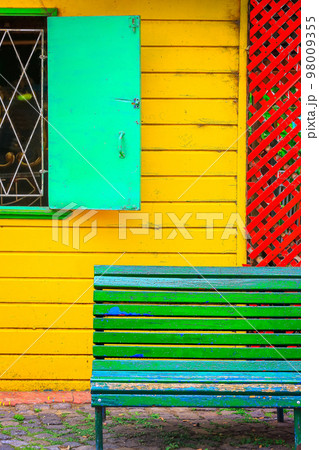 Colorful facade on Caminito Street with seat bench, in Buenos Aires, Argentina Colorful facade on Caminito Street with seat bench, in Buenos Aires, Argentina 98009355