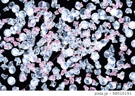 Sparkling Gemstone Diamond and plastic rock fly floating in mid air. Many group gem Diamonds shape as crystal luxury jewel fall as wealth money. Black background isolated Sparkling Gemstone Diamond and plastic rock fly floating in mid air. Many group gem Diamonds shape as crystal luxury jewel fall as wealth money. Black background isolated 98010191