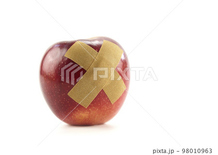 red apple with bandage isolated on white background 98010963