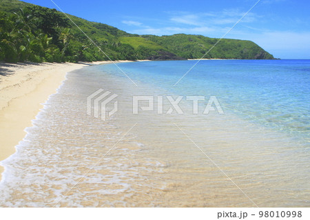 Tropical sandy beach at summer day in Fiji Islands, Pacific ocean Tropical sandy beach at summer day in Fiji Islands, Pacific ocean 98010998