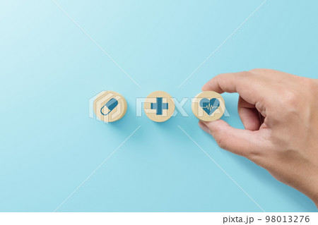 Hand arranging wood block with icon healthcare medical, Insurance for your health concept Hand arranging wood block with icon healthcare medical, Insurance for your health concept 98013276