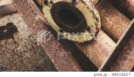 Old rusty metal pipe connection. Scrap metal - predominantly ferrous metals. Waste from industry. Old rusty metal pipe connection. Scrap metal - predominantly ferrous metals. Waste from industry. 98018027