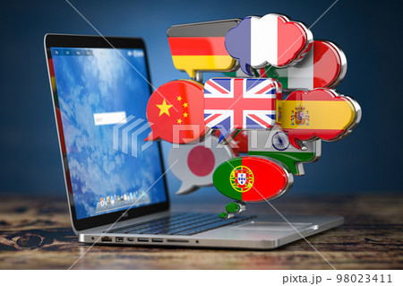 Global communication, dictionary, translating and learning languages online app concept. Laptop and speech bubbles with flags. Global communication, dictionary, translating and learning languages online app concept. Laptop and speech bubbles with flags. 98023411