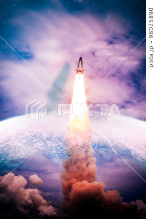 Shuttle launch in the clouds to outer space. Dark space with stars on background.Spaceship flight. Elements of this image furnished by NASA 98025890