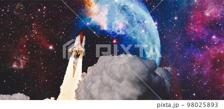 Shuttle launch in the clouds to outer space. Dark space with stars on background.Spaceship flight. Elements of this image furnished by NASA 98025893