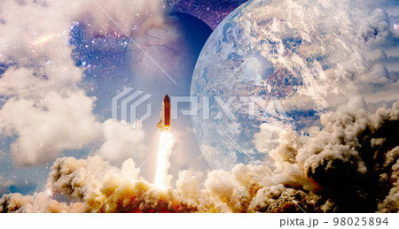 Shuttle launch in the clouds to outer space. Dark space with stars on background.Spaceship flight. Elements of this image furnished by NASA Shuttle launch in the clouds to outer space. Dark space with stars on background.Spaceship flight. Elements of this image furnished by NASA 98025894