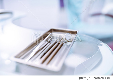 A set of sterile dental instruments for dental treatment. Dental care for people. 98026436