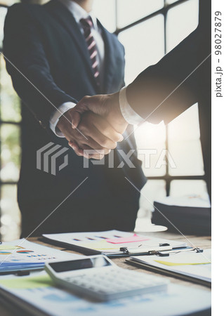 Business partnership meeting concept. Image businessmans handshake. Successful businessmen handshaking after good deal. Group support concept. 98027879