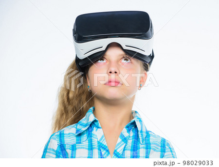 Happy kid use modern technology virtual reality. Virtual education for school pupil. Get virtual experience. Girl cute child with head mounted display on white background. Virtual reality concept 98029033